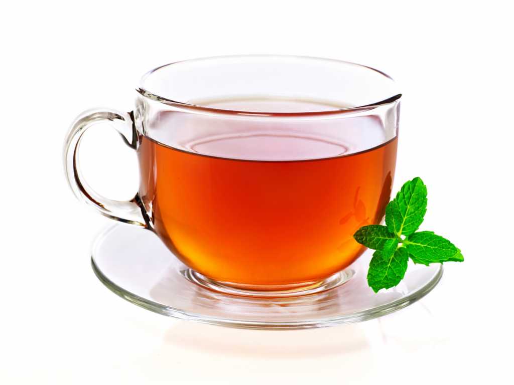Cup of tea with mint, isolated on white