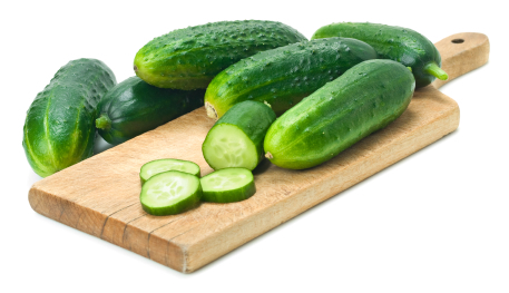 Sliced Cucumbers on Cutting Board. This file is cleaned, retouched and contains clipping path.