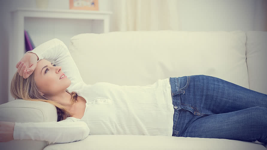 woman-lying-on-sofa-and-thinking